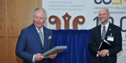 Prince Charless receiving a UCEM tie from Ashley