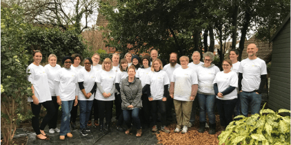 A group shot of smiling volunteers